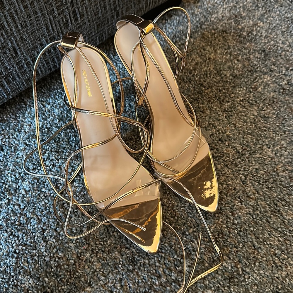 Only worn once for photo-shoot, gold strappy shoes, size 9